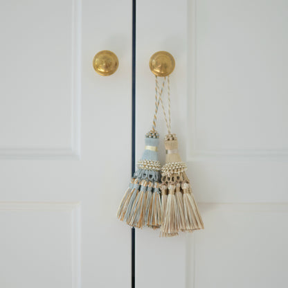 Light blue cream & copper tassel