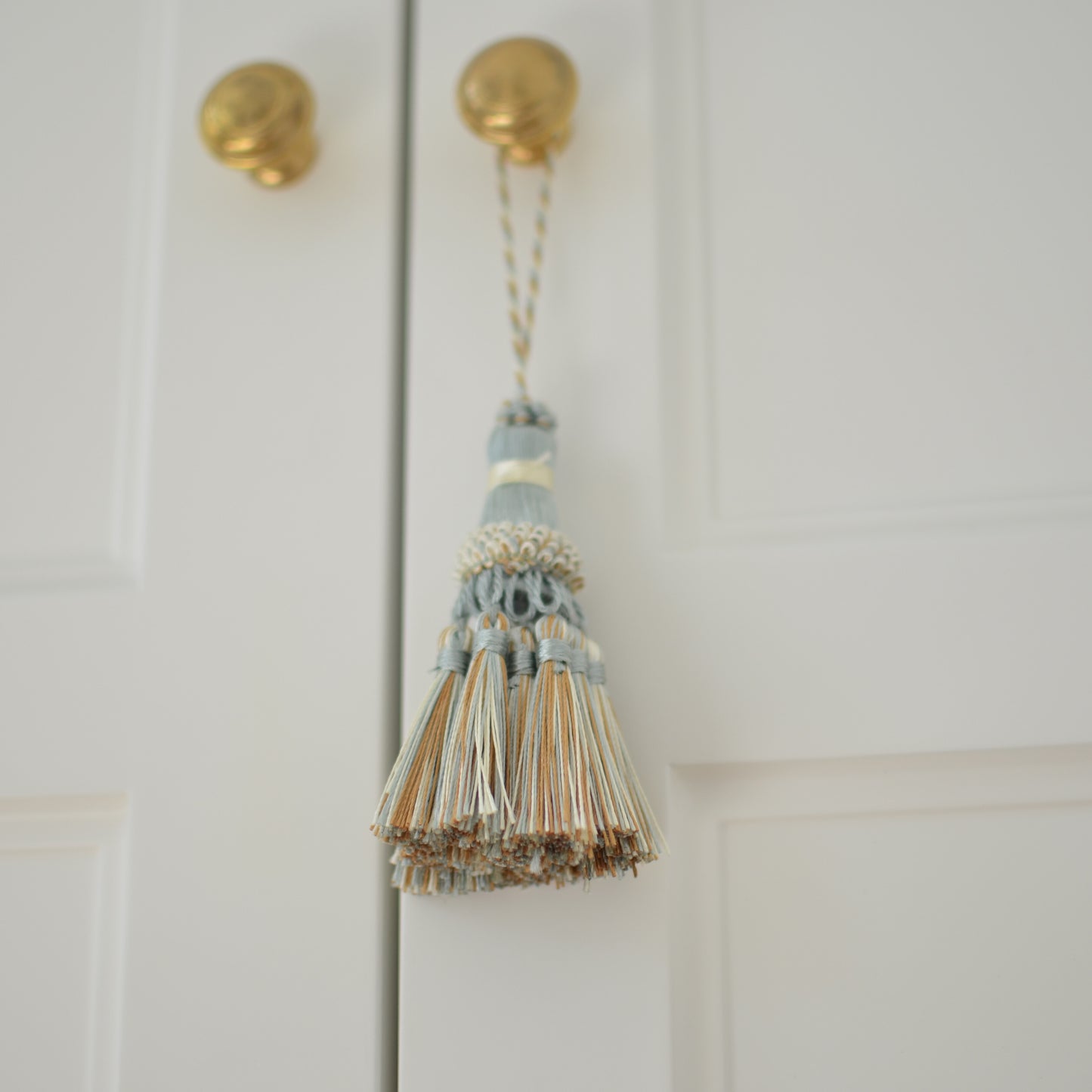 Light blue cream & copper tassel