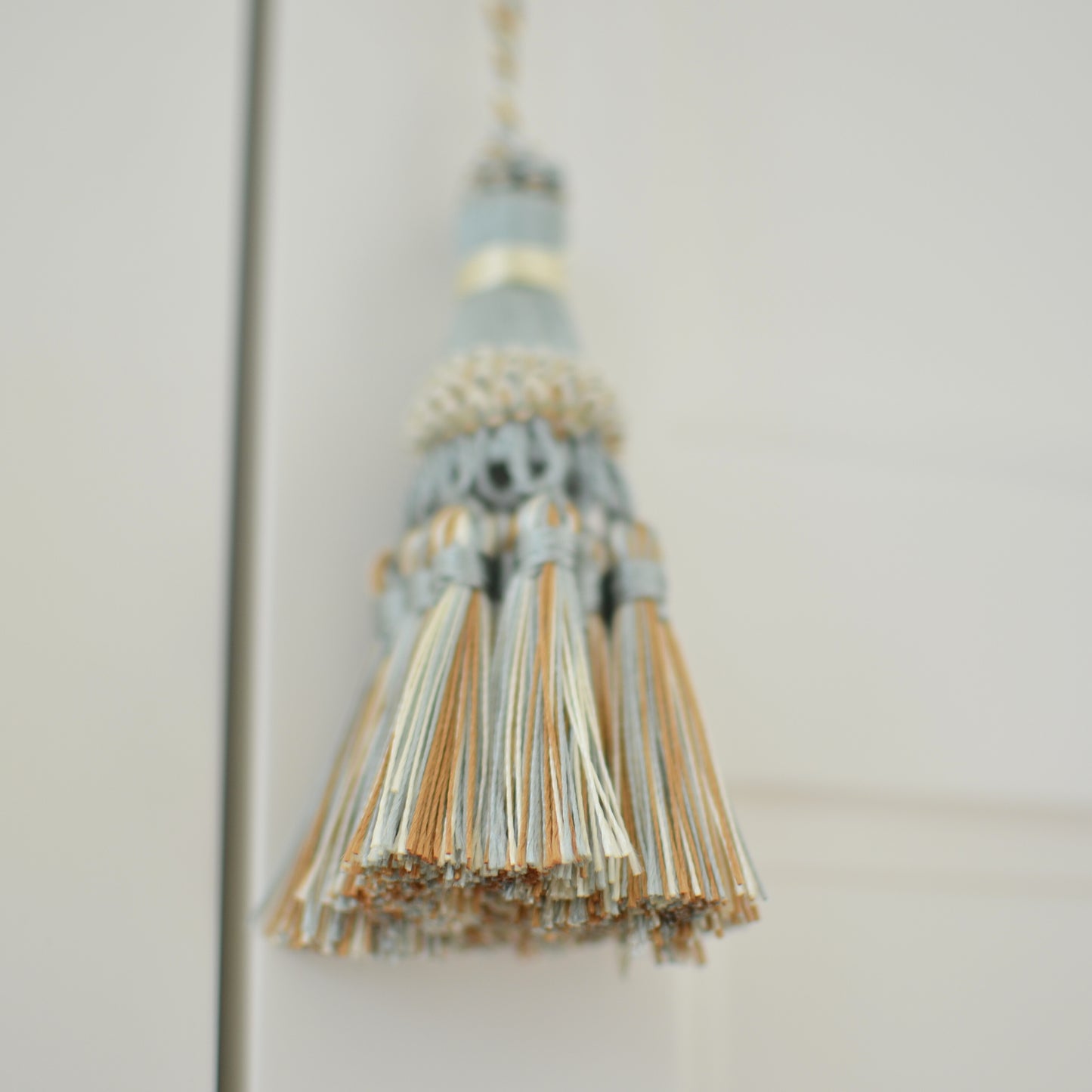 Light blue cream & copper tassel