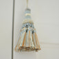Light blue cream & copper tassel