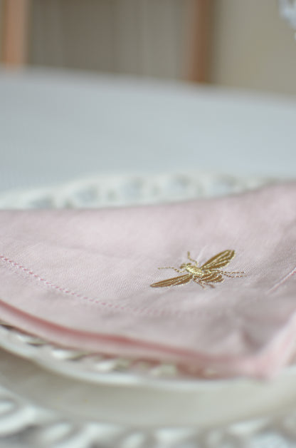 Pink cotton napkin with a bumblebee motif