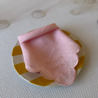 Monogrammed pink linen napkin with a pink scalloped edge