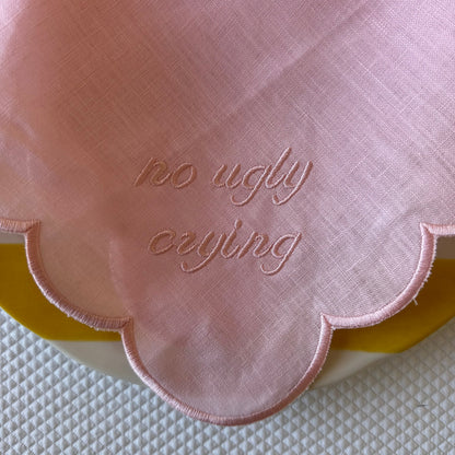 Monogrammed pink linen napkin with a pink scalloped edge