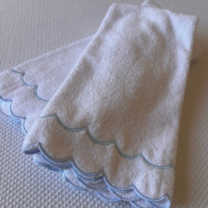 A scalloped edge hand towel set of two