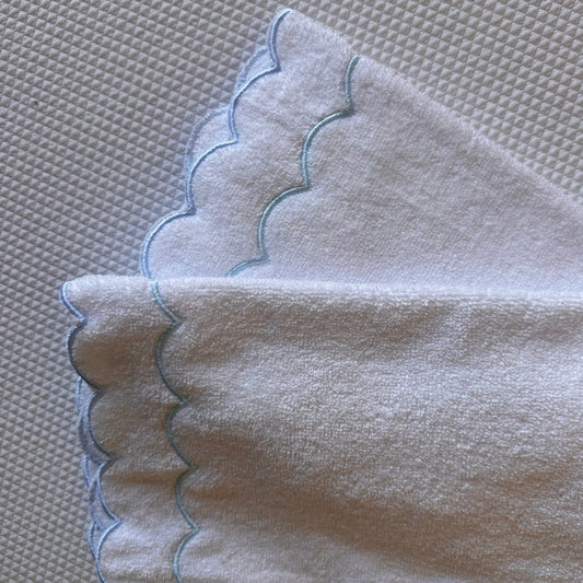 A scalloped edge hand towel set of two