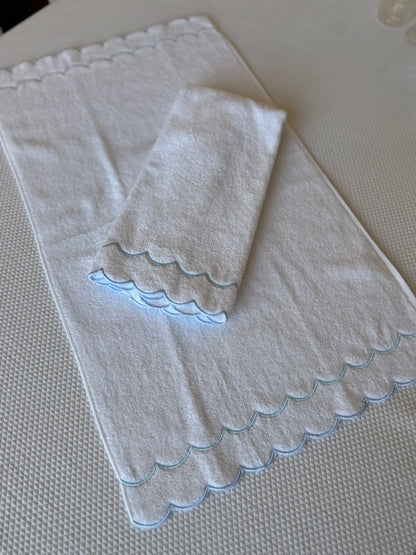 A scalloped edge hand towel set of two