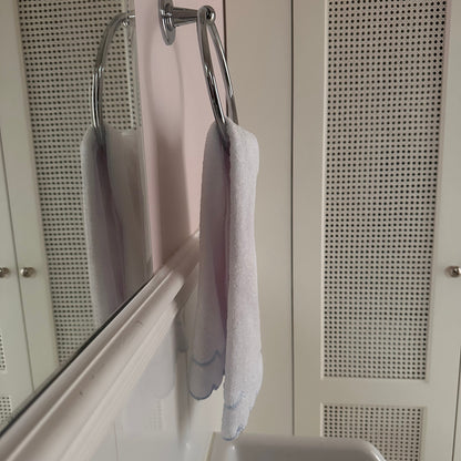 A scalloped edge hand towel set of two