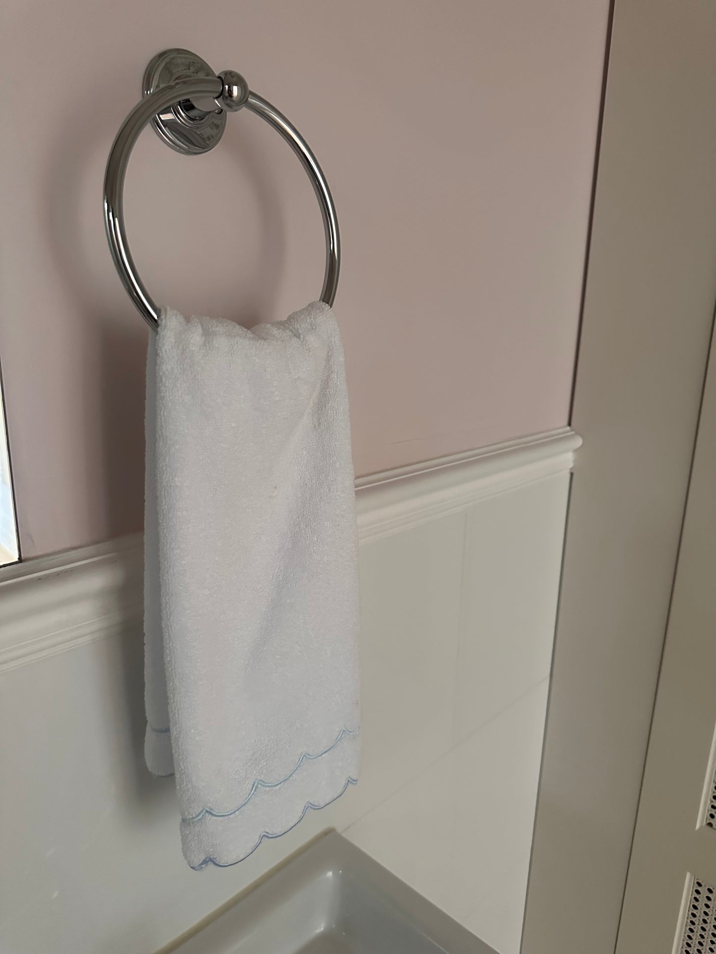 A scalloped edge hand towel set of two