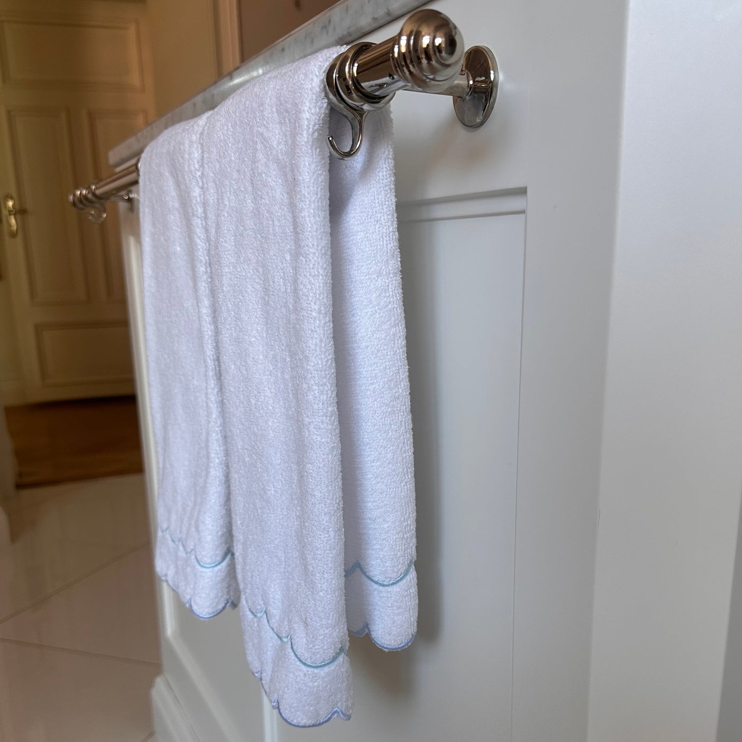 A scalloped edge hand towel set of two