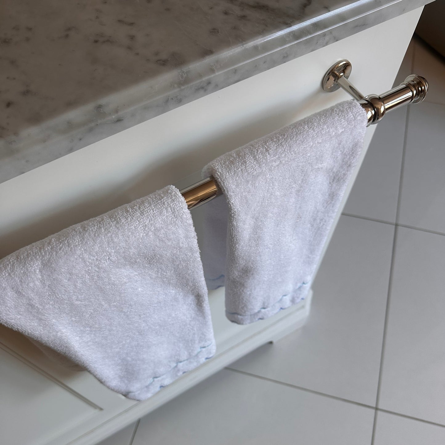 A scalloped edge hand towel set of two