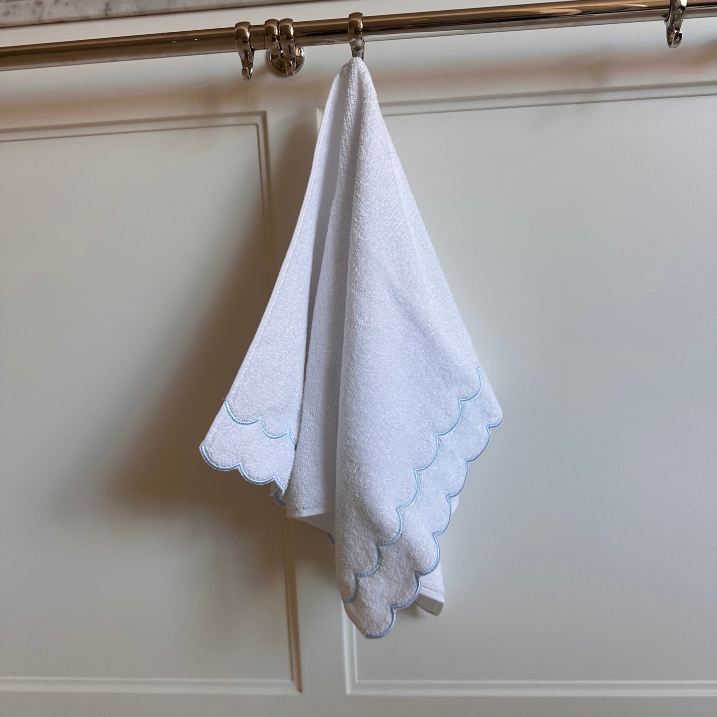 A scalloped edge hand towel set of two