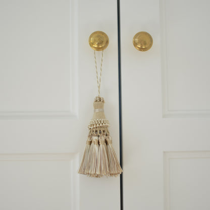 Tassel in creamy golden beige